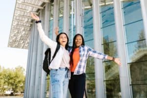 two girls in front of building