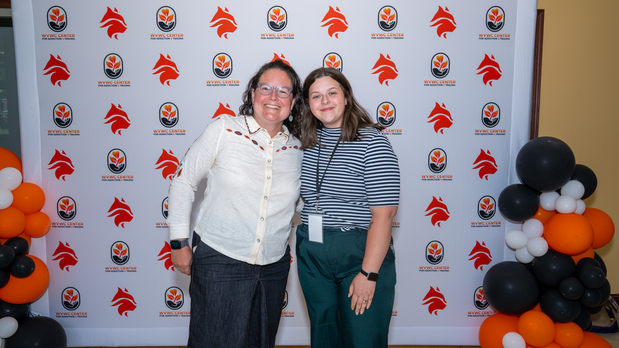 Two female attendees take a picture at the 2026 Summer Institute hosted by the Center for Addiction and Trauma at West Virginia Wesleyan College.